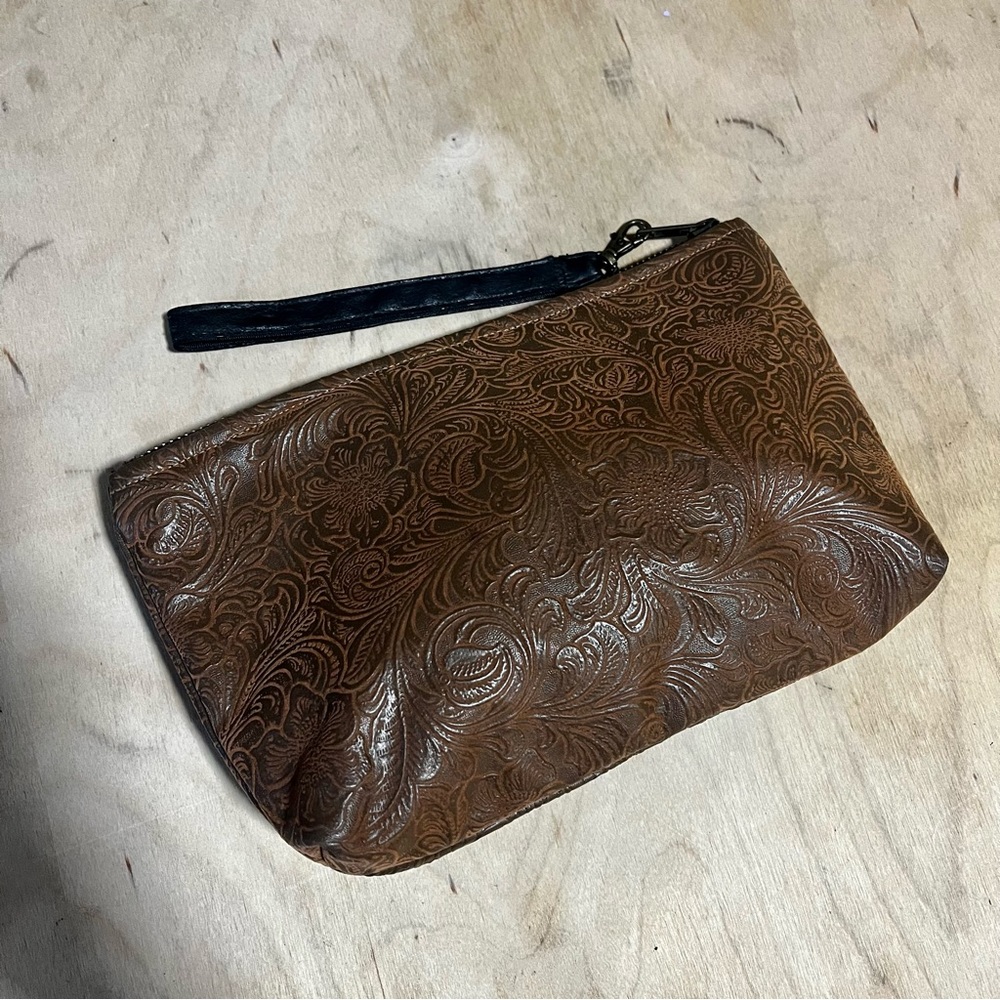 Handmade embossed leather clutch wristlet